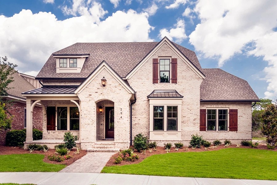 An attractive house with a durable brick exterior and a decorative stone front