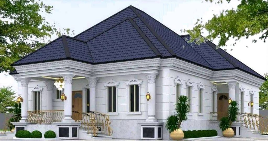 A small house featuring a blue roof and a staircase